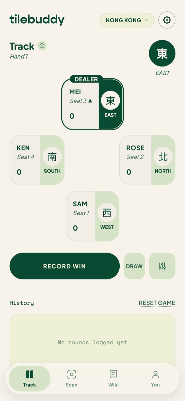 The Track board: four players with seat winds and points, Record win and Draw buttons